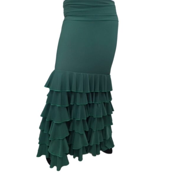 Falda de flamenco Esperanza con 6 volantes. Tela elástica muy adaptable, con cinturilla elástica para doblar. Efecto reductor. Ideal para ensayo o actuación. En color verde botella o negro.